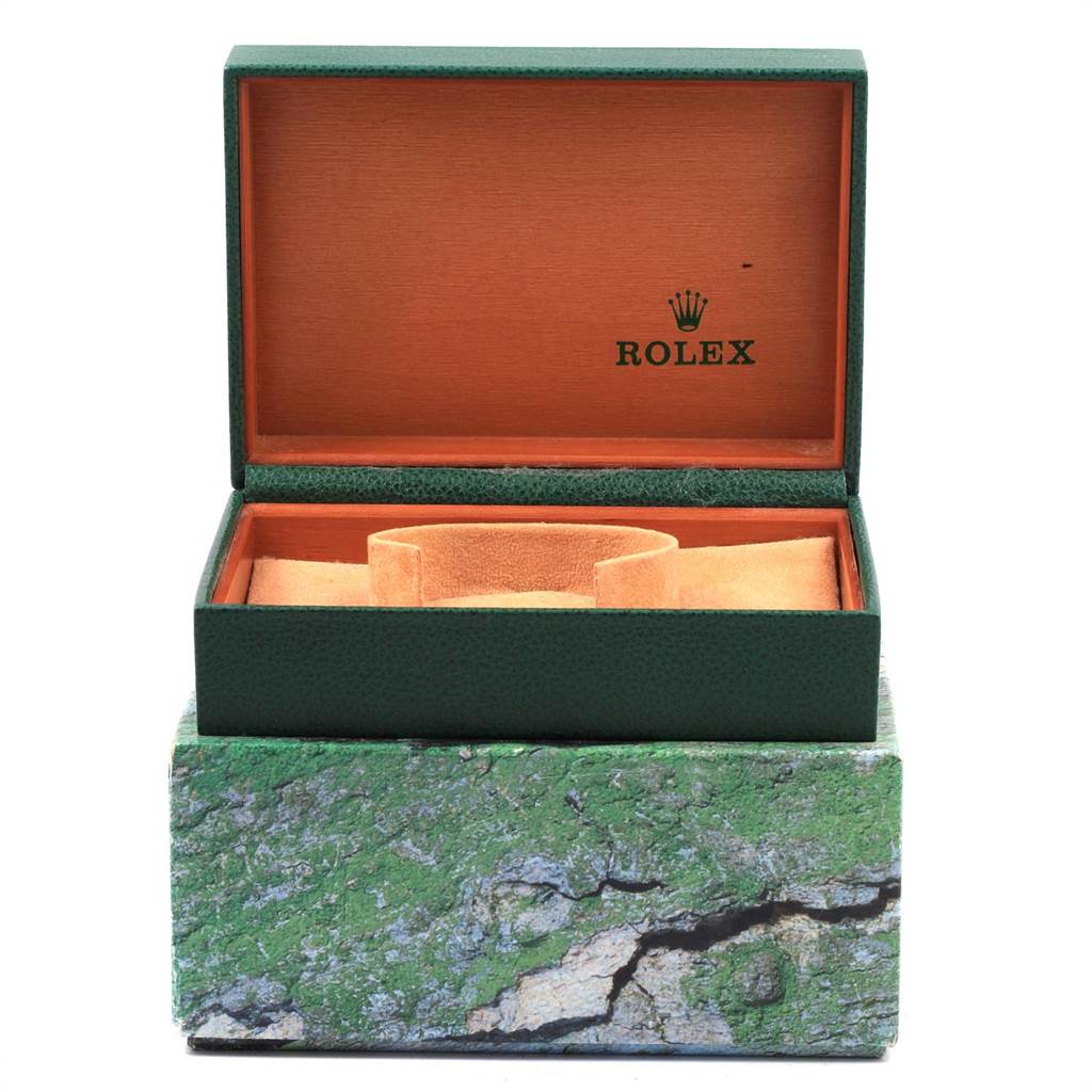 The image shows an open Rolex Explorer 114270 Men's Stainless Steel Black Dial 114270 Men's Stainless Steel Black Dial model watch box with a green exterior and beige interior at a front angle.