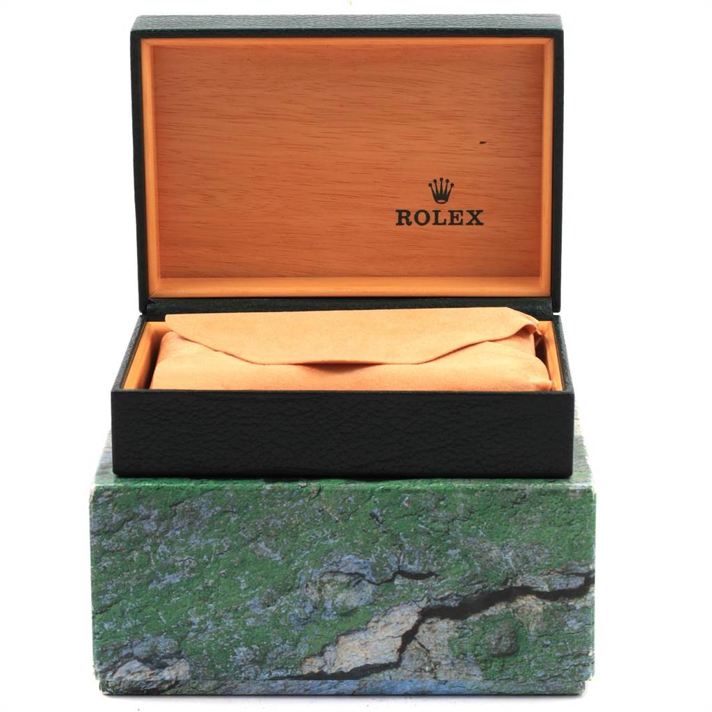 An open Rolex watch box with the cushion inside, showing a top-down view of the interior and the brand logo.