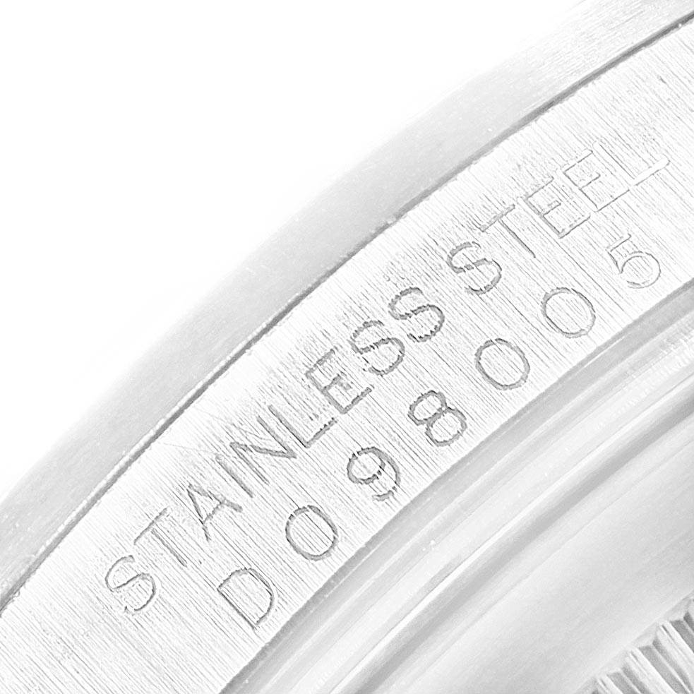 The image shows a close-up of the stainless steel casing with engraved serial numbers on the side of a Rolex Explorer 16570 Men's Stainless Steel White Dial 16570 Men's Stainless Steel White Dial watch.