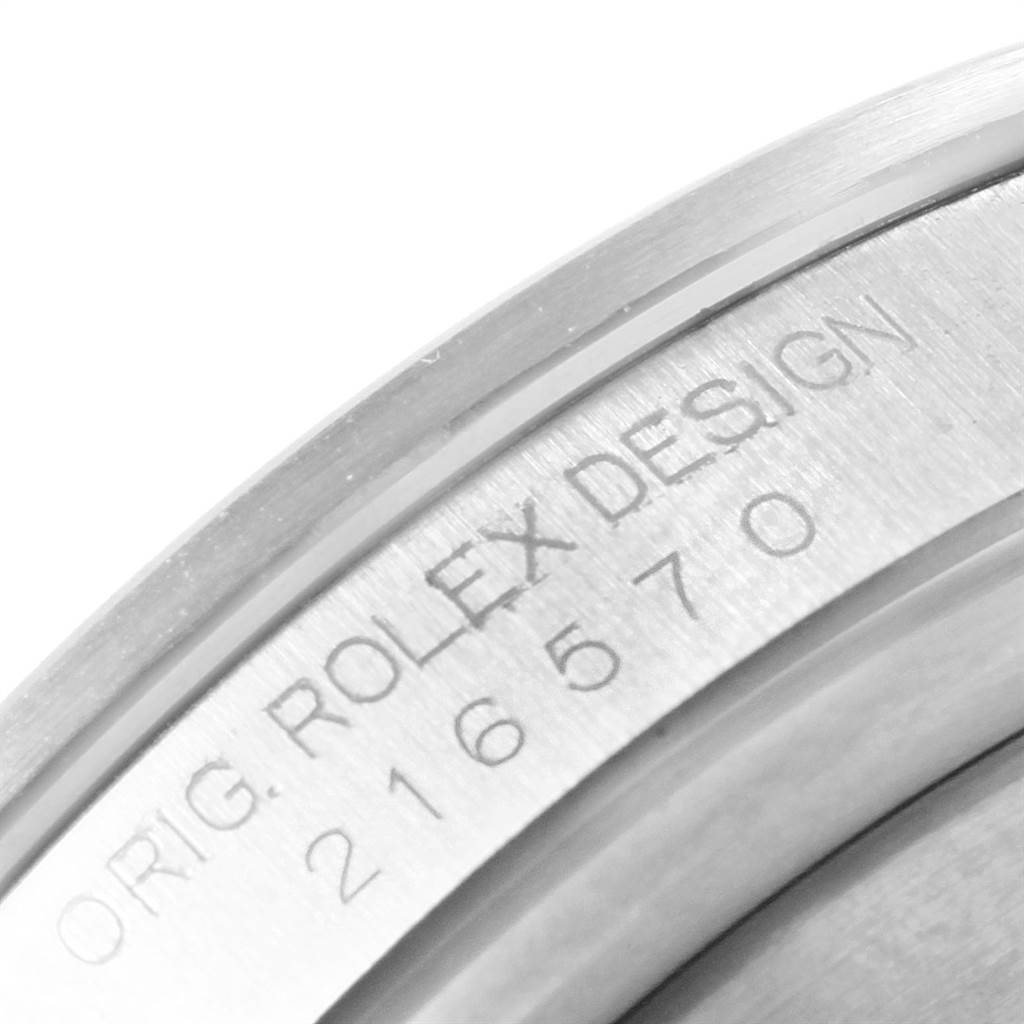The image shows a close-up angle of the inner bezel with the "ROLEX DESIGN" engraving and model number on a Rolex Explorer 216570 Men's Stainless Steel White Dial 216570 Men's Stainless Steel White Dial watch.