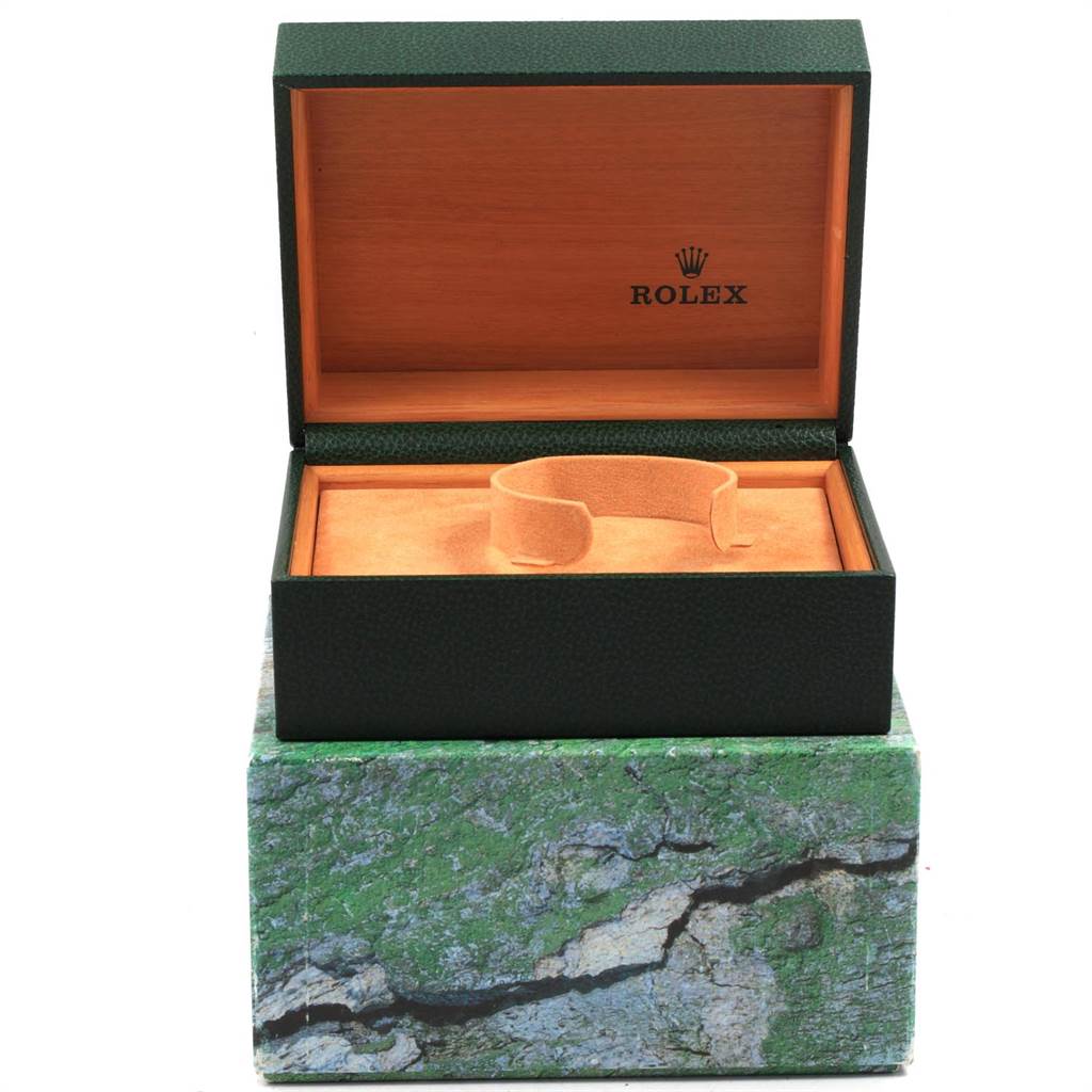 The image shows an open Rolex Explorer 16570 Men's Stainless Steel White Dial 16570 Men's Stainless Steel White Dial watch box with an inner stand and cushioned interior for the watch.