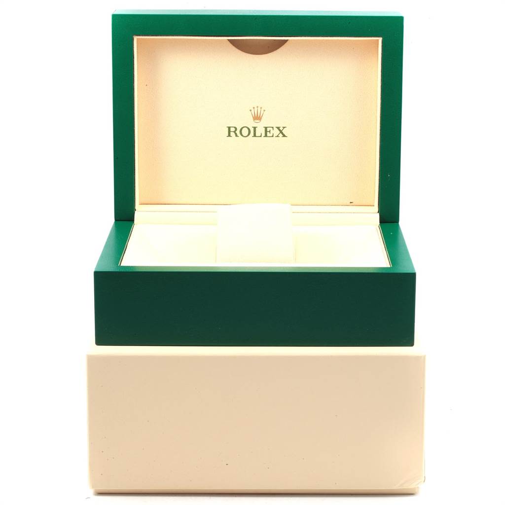 The image shows an open Rolex watch box from the Explorer model, with interior padding and the Rolex logo on the inside lid.