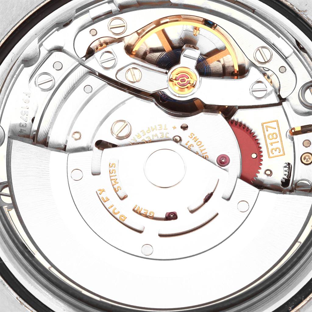 The image shows a close-up view of the movement and internal mechanics of a Rolex Explorer 216570 Men's Stainless Steel Black Dial 216570 Men's Stainless Steel Black Dial watch.
