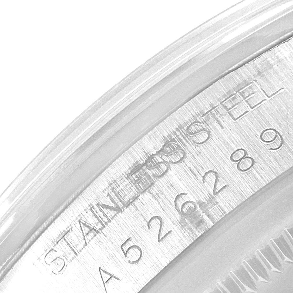The image shows a close-up of the case back edge of the Rolex Explorer 14270 Men's Stainless Steel Black Dial 14270 Men's Stainless Steel Black Dial, highlighting the stainless steel and serial number inscription.