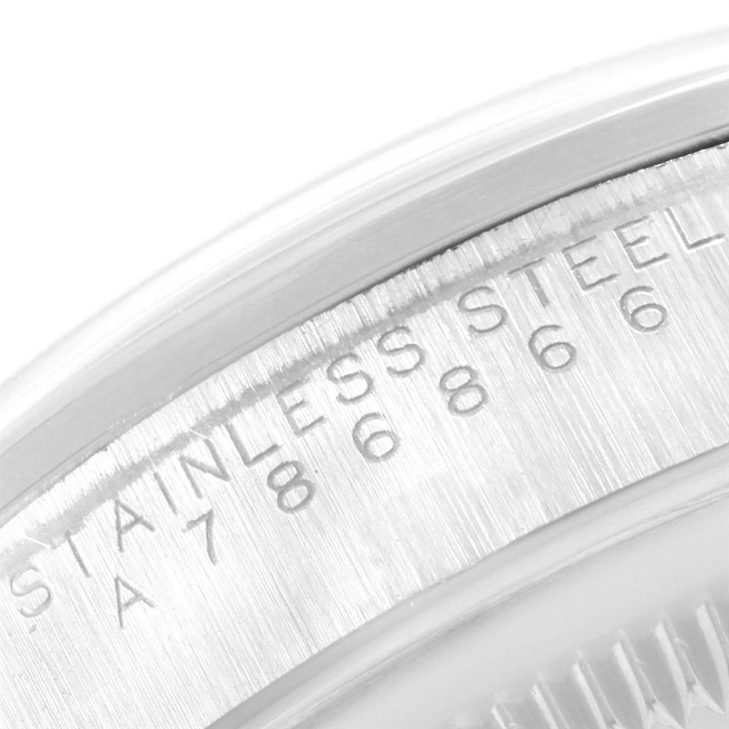 This image shows a close-up of the engraving on the stainless steel case back of a Rolex Explorer 14270 Men's Stainless Steel Black Dial 14270 Men's Stainless Steel Black Dial watch.