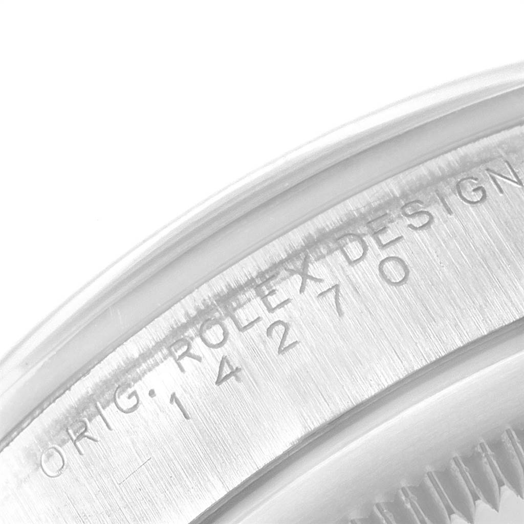 The image shows a close-up of the case back engraving on a Rolex Explorer 14270 Men's Stainless Steel Black Dial 14270 Men's Stainless Steel Black Dial watch, displaying the original design number.