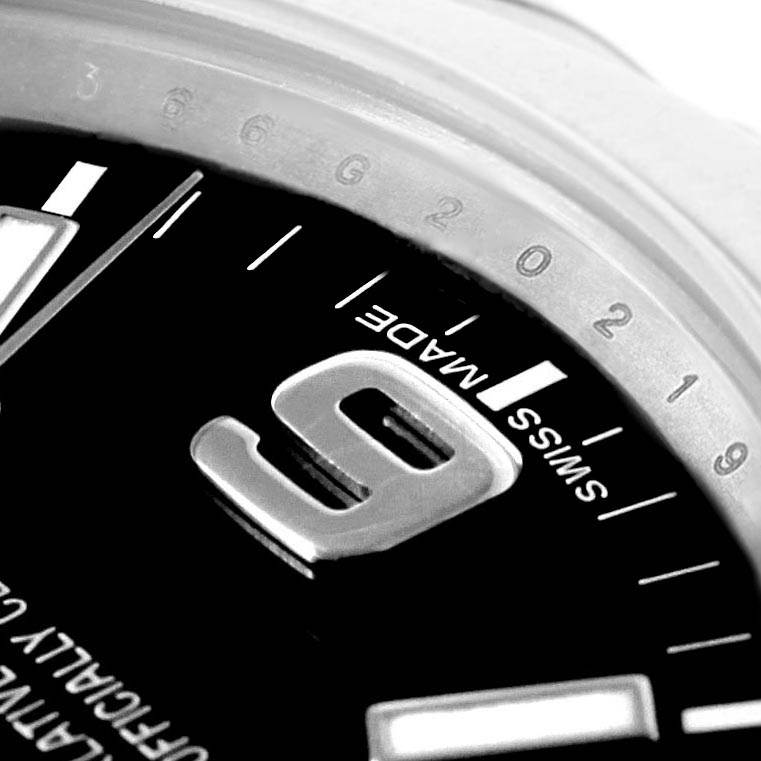 The image shows a close-up angle of the dial and bezel of a Rolex Explorer 214270 Men's Stainless Steel Black Dial 214270 Men's Stainless Steel Black Dial watch, highlighting the "9" marker and "Swiss Made" text.
