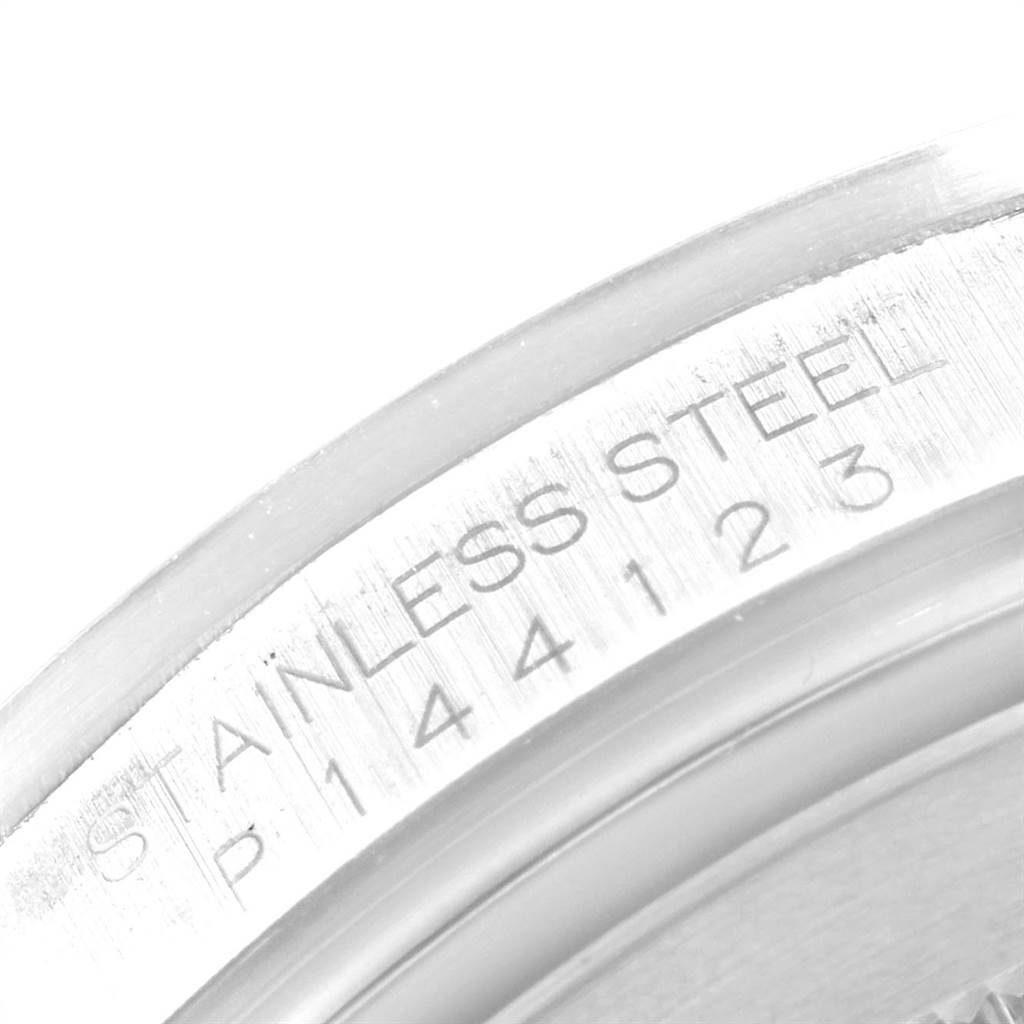 The image shows a close-up of the stainless steel casing and serial number engraving of a Rolex Explorer 16570 Men's Stainless Steel White Dial 16570 Men's Stainless Steel White Dial watch.