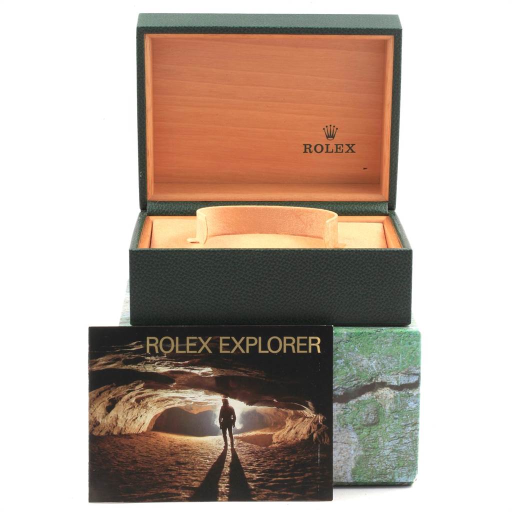 The image shows the open box and packaging for a Rolex Explorer 16570 Men's Stainless Steel White Dial 16570 Men's Stainless Steel White Dial watch, along with its branded booklet.