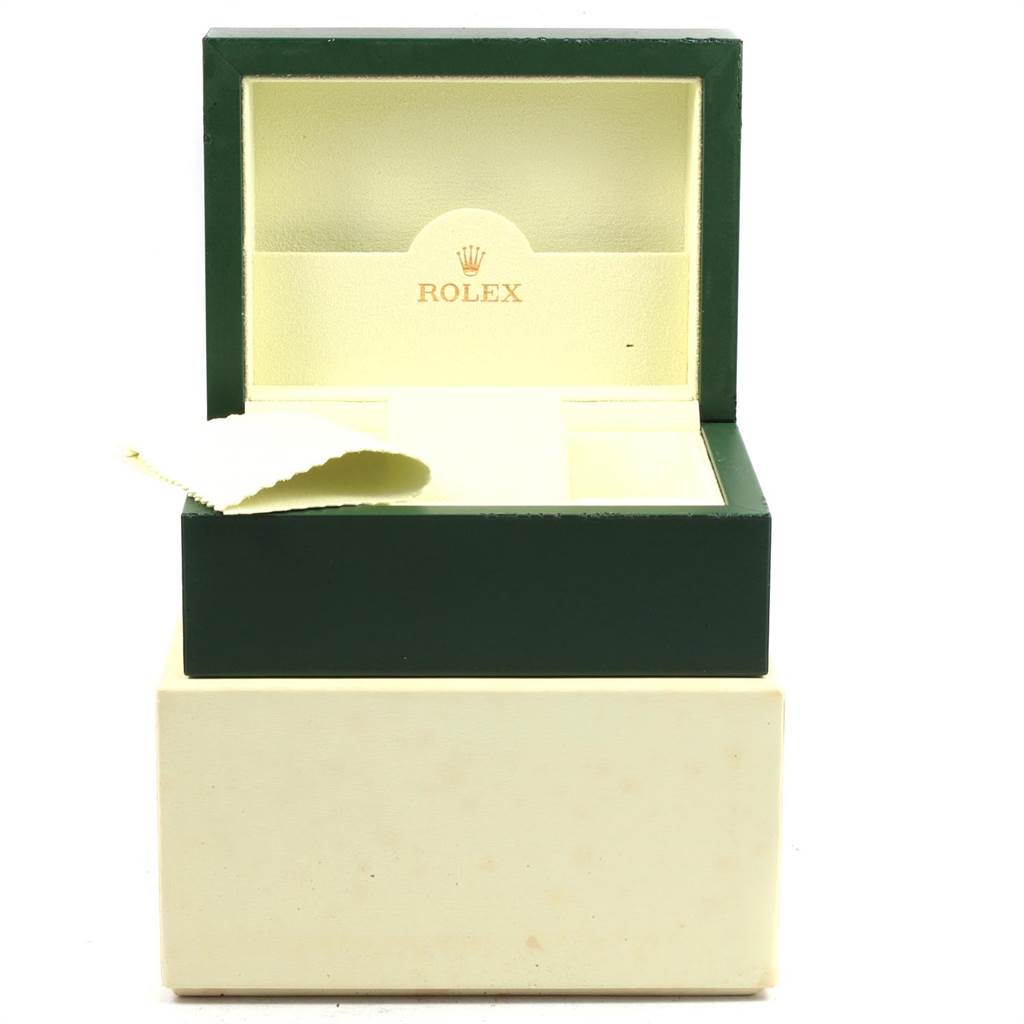 The image shows an open green and beige Rolex Explorer 114270 Men's Stainless Steel Black Dial 114270 Men's Stainless Steel Black Dial watch box with a cleaning cloth inside.