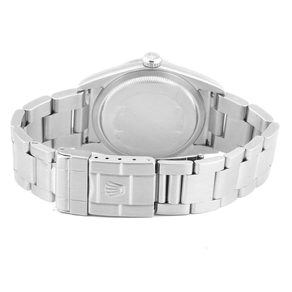 The image shows the back angle of the Rolex Explorer 114270 Men's Stainless Steel Black Dial 114270 Men's Stainless Steel Black Dial watch highlighting its closed clasp and metal bracelet.