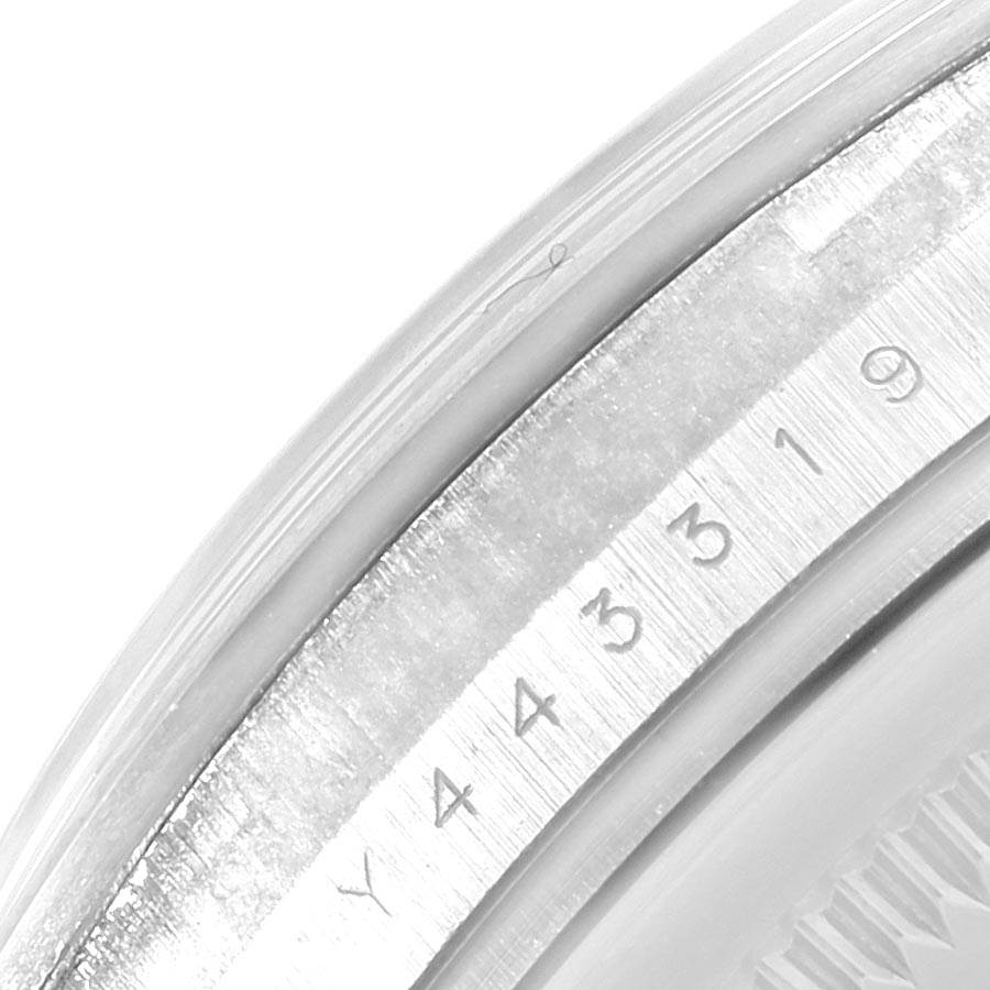 The image shows a close-up of the serial number engraving on the edge of a Rolex Explorer 114270 Men's Stainless Steel Black Dial 114270 Men's Stainless Steel Black Dial model watch case.