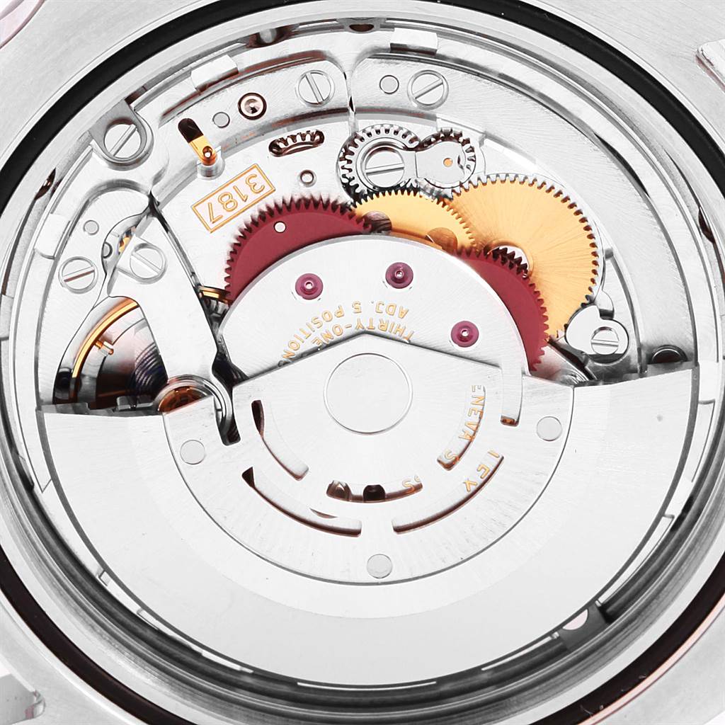 This is a close-up of the Rolex Explorer 216570 Men's Stainless Steel Black Dial 216570 Men's Stainless Steel Black Dial watch movement, showing gears and mechanical components.