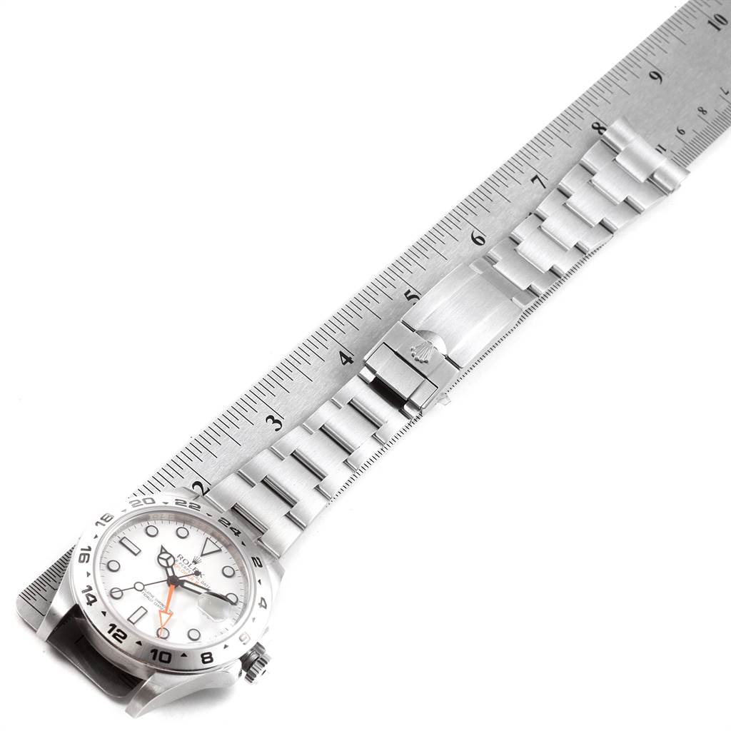 The image shows a top-down view of a Rolex Explorer 216570 Men's Stainless Steel White Dial 216570 Men's Stainless Steel White Dial watch, highlighting its face, bracelet, clasp, and part of the bezel.