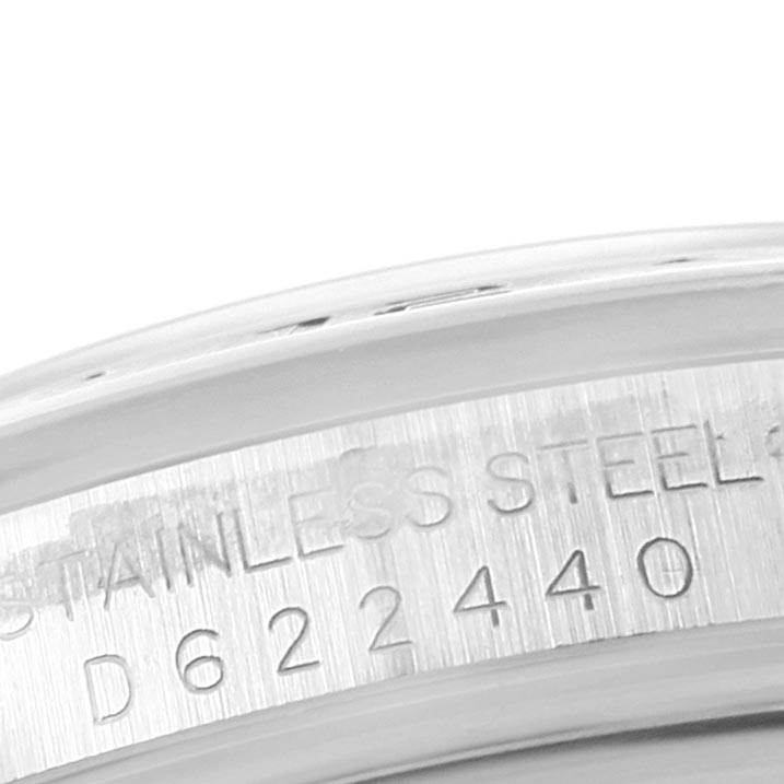 This image shows a close-up of the serial number and stainless steel marking on the bezel of a Rolex Explorer 16570 Men's Stainless Steel Black Dial 16570 Men's Stainless Steel Black Dial watch.