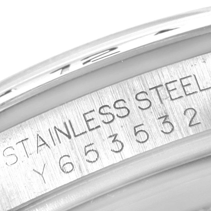 This close-up image shows the engraved serial number on the stainless steel case of the Rolex Explorer 16570 Men's Stainless Steel White Dial 16570 Men's Stainless Steel White Dial watch.
