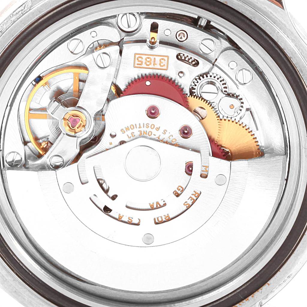 The image shows the intricate inner mechanism of a Rolex Explorer 16570 Men's Stainless Steel White Dial 16570 Men's Stainless Steel White Dial watch, highlighting its movement components and gears.