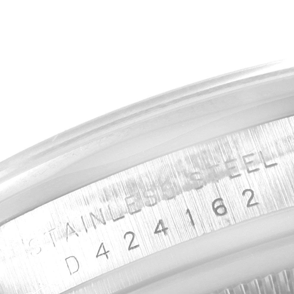 This image shows a close-up of the serial number engraved on the stainless steel caseback of a Rolex Explorer Men's Stainless Steel Black Dial Men's Stainless Steel Black Dial watch.