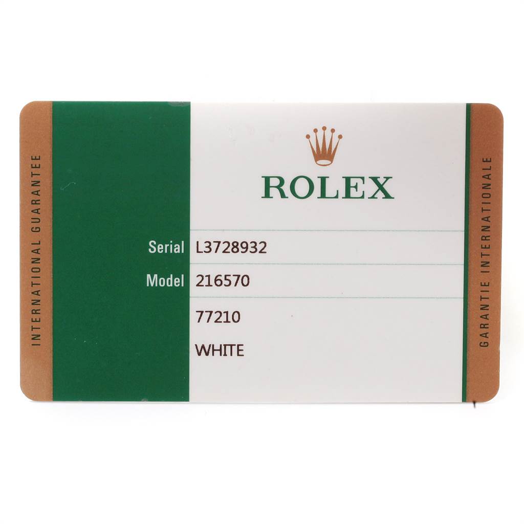 The image shows the warranty card for the Rolex Explorer 216570 Men's Stainless Steel White Dial 216570 Men's Stainless Steel White Dial model 216570, displaying the serial number and color.
