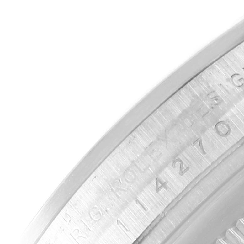 The image shows the inner bezel or rehaut of a Rolex Explorer 114270 Men's Stainless Steel Black Dial 114270 Men's Stainless Steel Black Dial watch with the engraved serial number and brand markings.