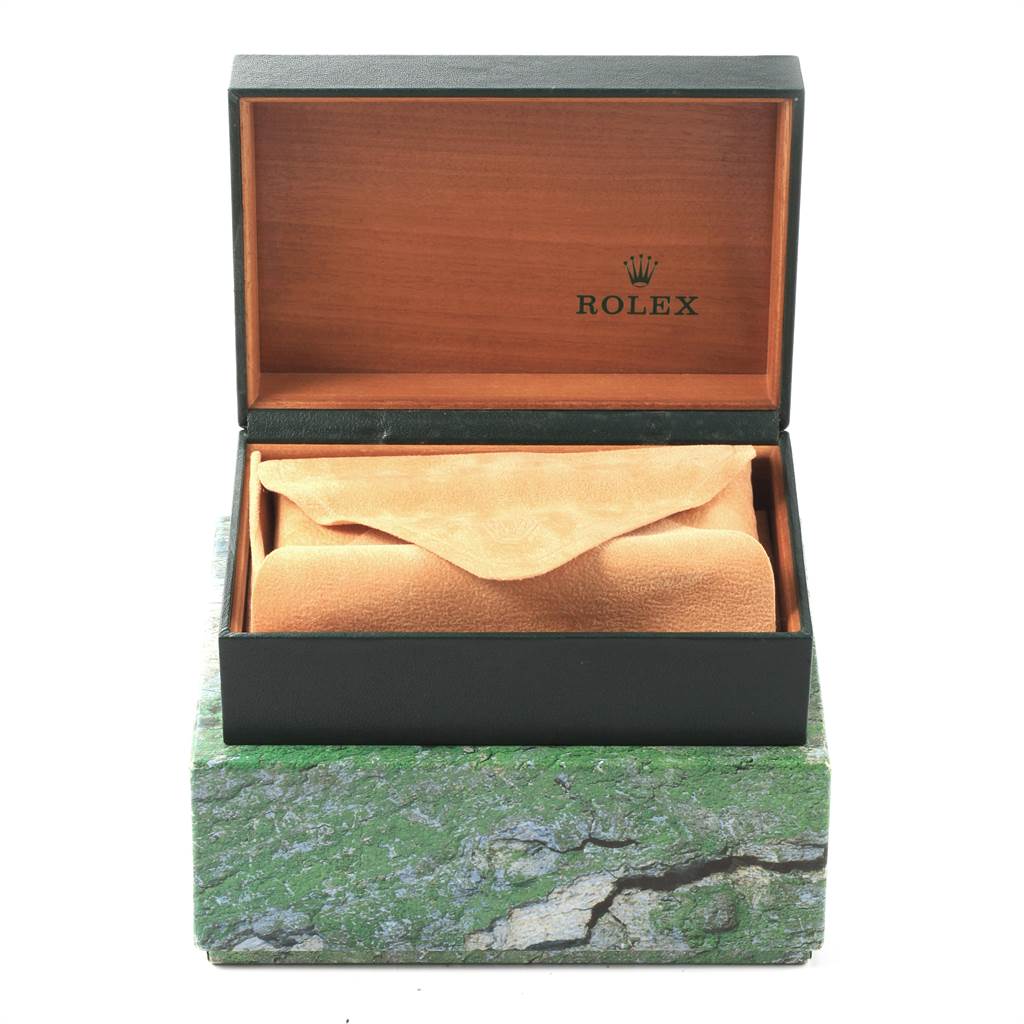 The image shows a Rolex Explorer 114270 Men's Stainless Steel Black Dial 114270 Men's Stainless Steel Black Dial model watch box open, revealing the interior and a beige cloth pouch inside.