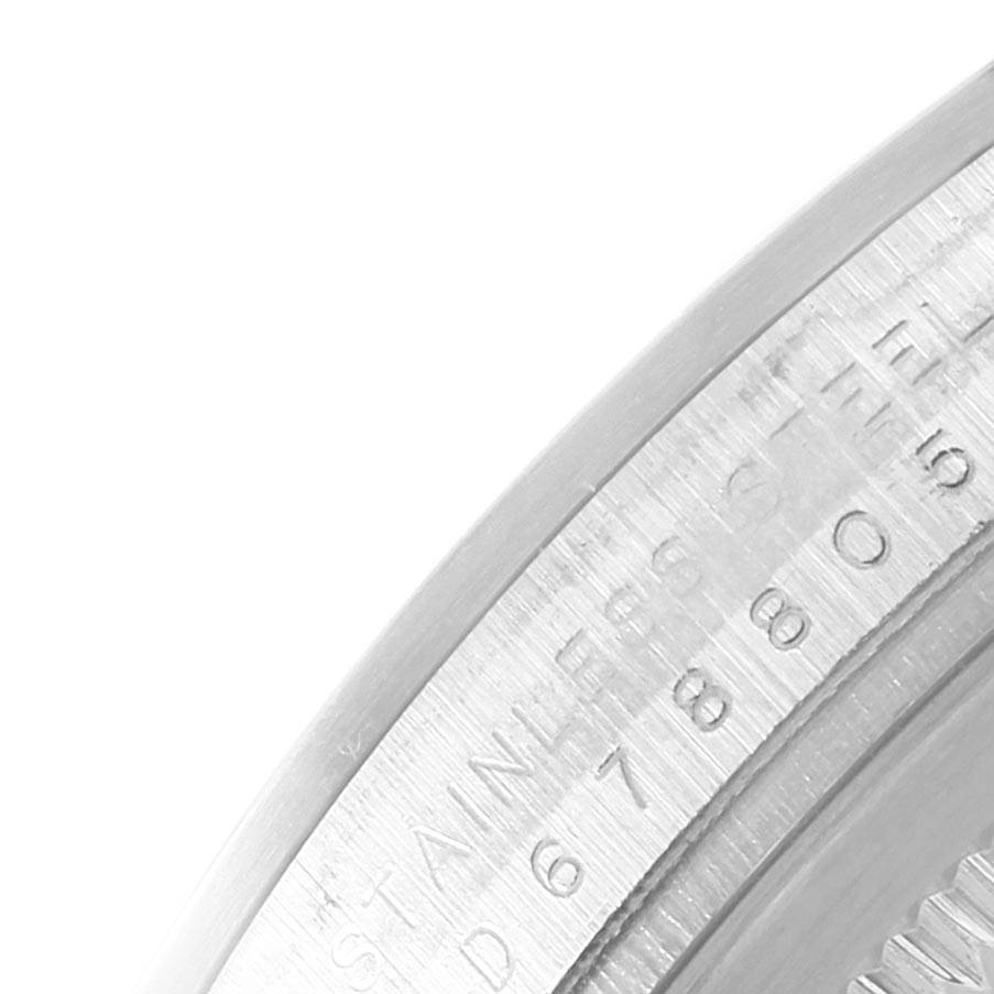 The image shows a close-up of the bezel and part of the case side of a Rolex Explorer 114270 Men's Stainless Steel Black Dial 114270 Men's Stainless Steel Black Dial watch with visible engravings.