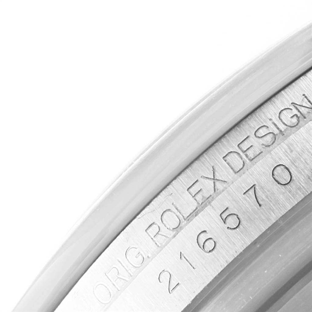 The image shows a close-up of the case back and serial number engraving of a Rolex Explorer 216570 Men's Stainless Steel White Dial 216570 Men's Stainless Steel White Dial watch.