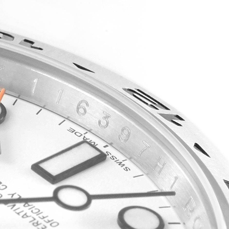This image shows a close-up of the dial and bezel of a Rolex Explorer 216570 Men's Stainless Steel White Dial 216570 Men's Stainless Steel White Dial watch, highlighting the hour markers and part of the casing.