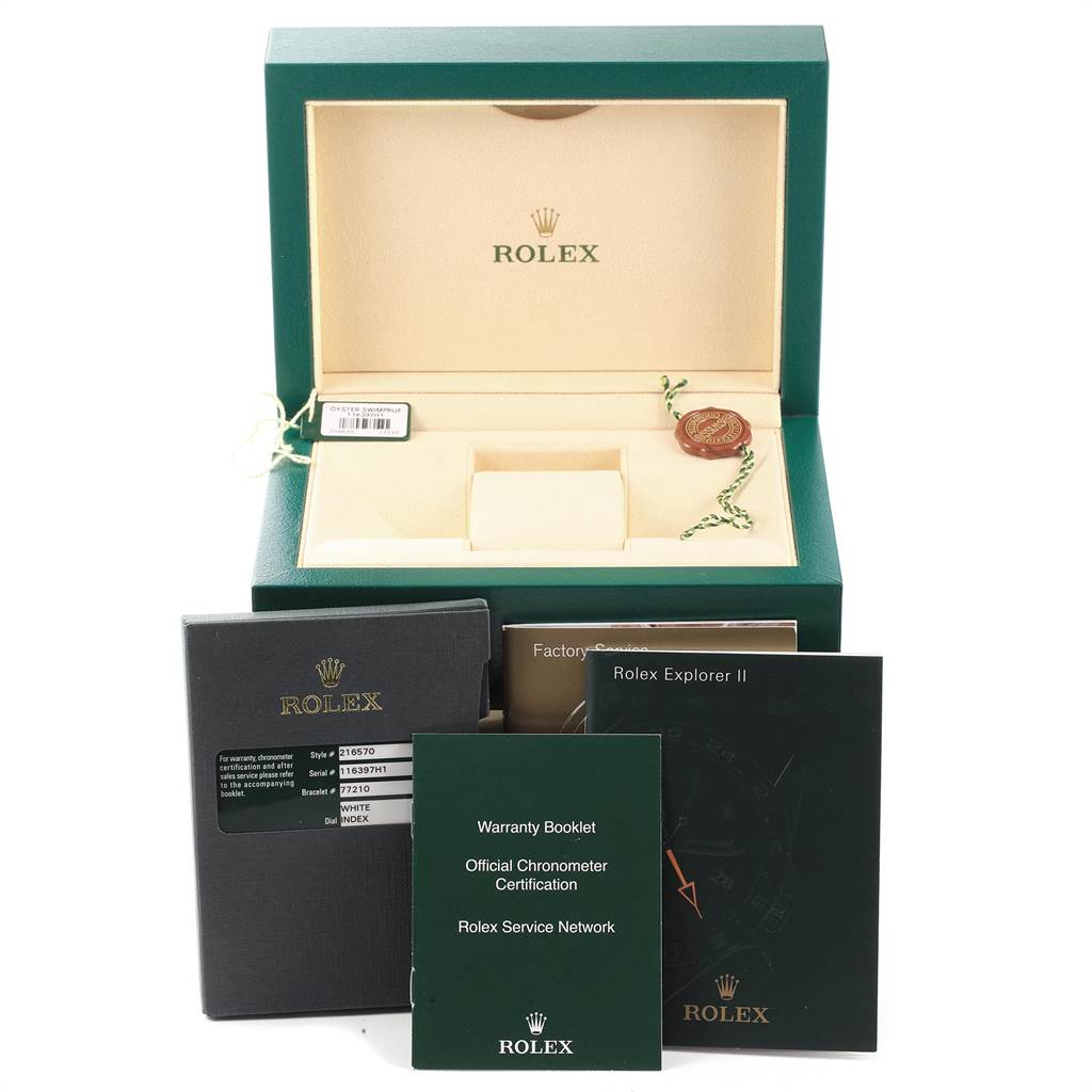 The image shows the packaging and accessories for a Rolex Explorer 216570 Men's Stainless Steel White Dial 216570 Men's Stainless Steel White Dial model, including the box, warranty booklet, and instruction manuals.