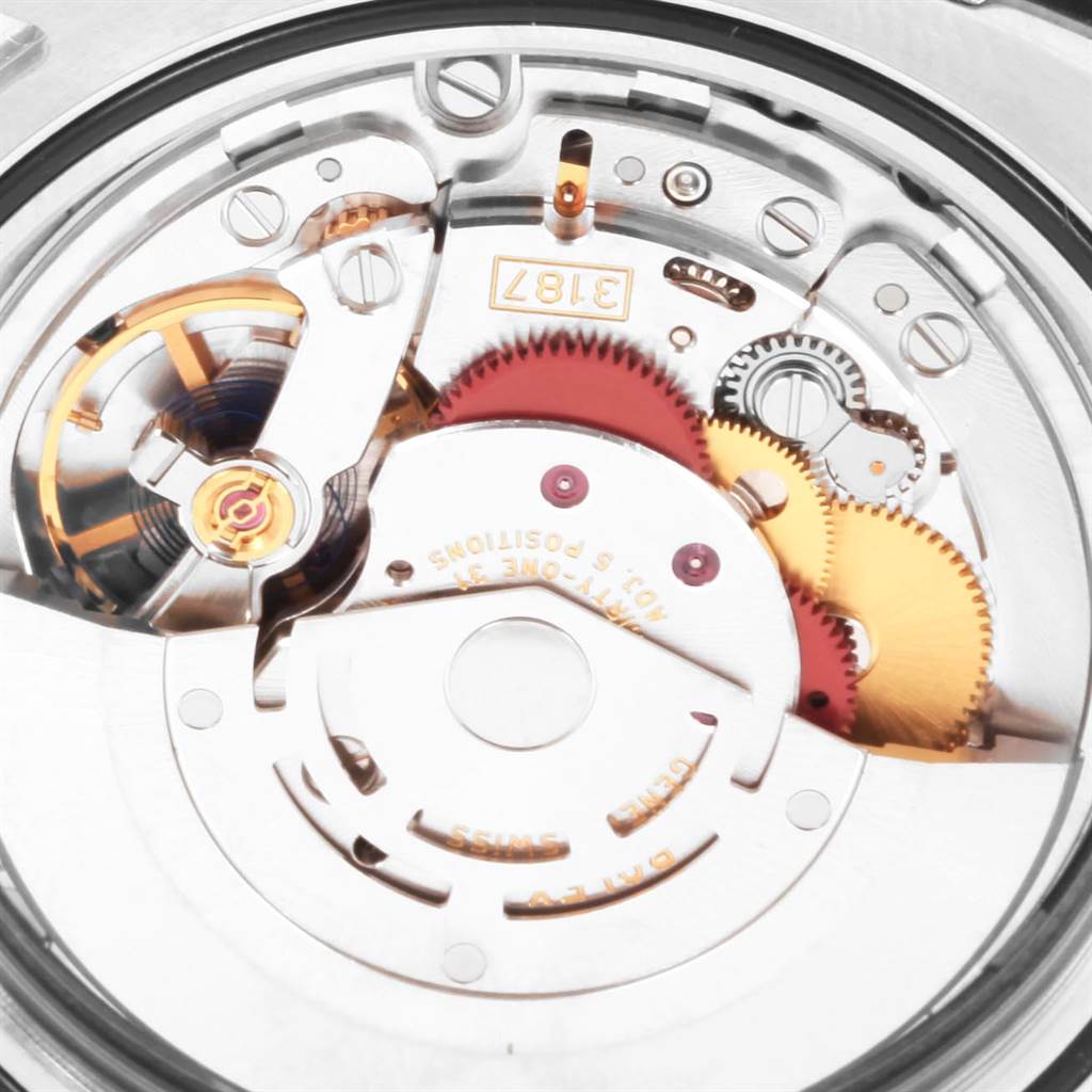 This image shows a close-up of the internal mechanical movement of a Rolex Explorer 216570 Men's Stainless Steel White Dial 216570 Men's Stainless Steel White Dial watch, highlighting gears and other intricate components.