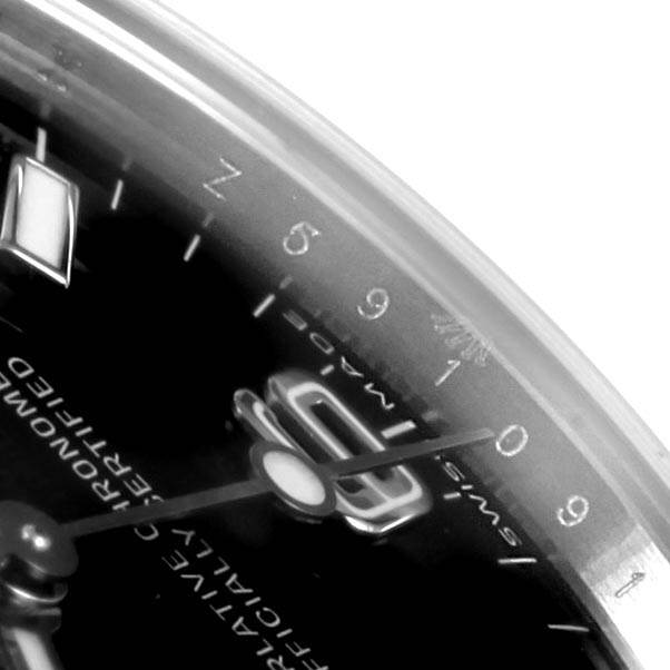 This close-up of a Rolex Explorer 114270 Men's Stainless Steel Black Dial 114270 Men's Stainless Steel Black Dial watch shows the dial, hands, and part of the bezel from a slightly tilted angle.