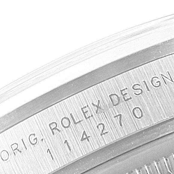 The image shows a close-up of the side engraving on the bezel of the Rolex Explorer 114270 Men's Stainless Steel Black Dial 114270 Men's Stainless Steel Black Dial watch.