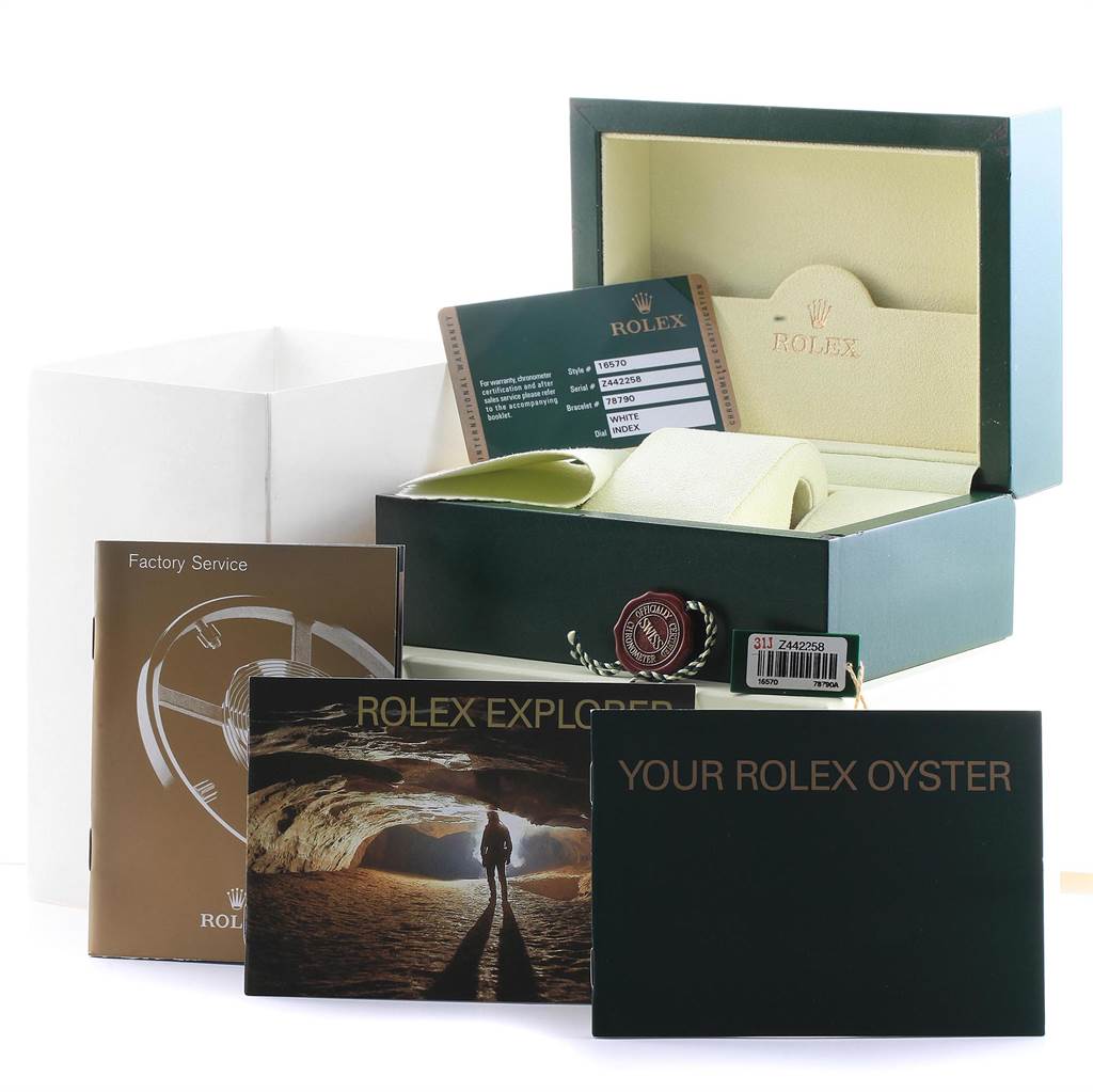 The image shows the packaging, manuals, and accessories for the Rolex Explorer 16570 Men's Stainless Steel White Dial 16570 Men's Stainless Steel White Dial model.