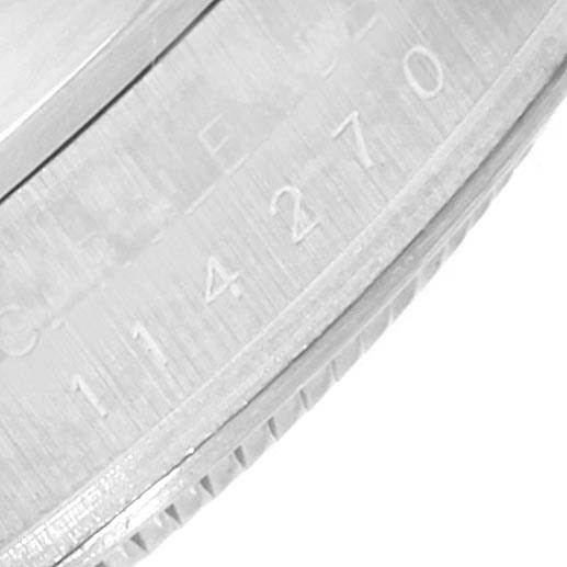 This image shows a close-up of the case side edge of a Rolex Explorer 114270 Men's Stainless Steel Black Dial 114270 Men's Stainless Steel Black Dial, highlighting the engraved serial number.