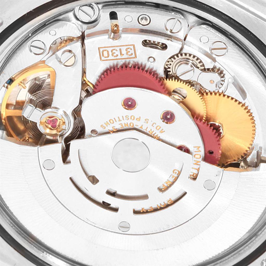 The image shows the internal mechanical movement of a Rolex Explorer 114270 Men's Stainless Steel Black Dial 114270 Men's Stainless Steel Black Dial watch, showcasing gears and intricate details.