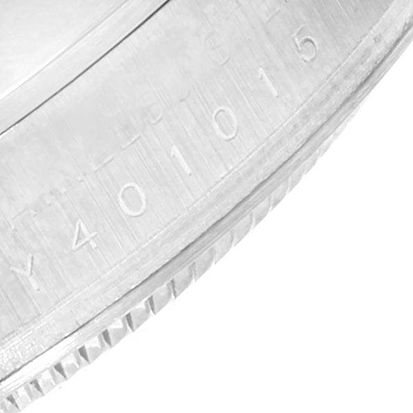 This image shows a close-up of the serial number engraved on the case edge of the Rolex Explorer 114270 Men's Stainless Steel Black Dial 114270 Men's Stainless Steel Black Dial watch.