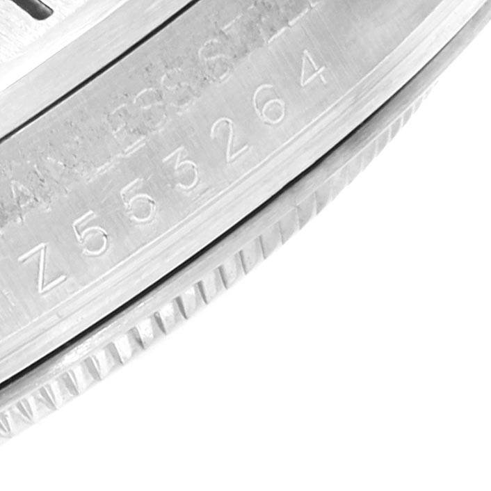 This image showcases a close-up of the serial number and part of the bezel of a Rolex Explorer 16570 Men's Stainless Steel White Dial 16570 Men's Stainless Steel White Dial watch.