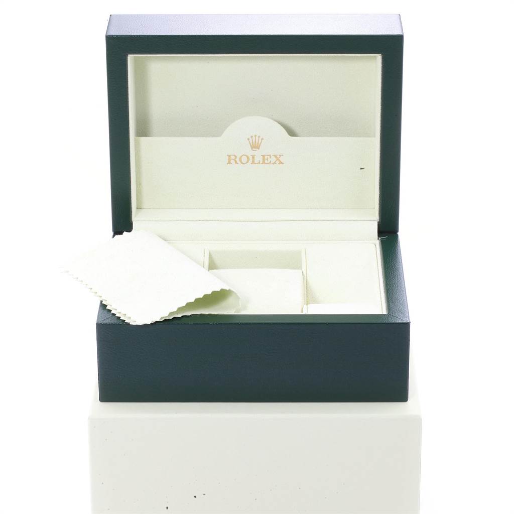 The image shows an open Rolex watch box for the Explorer model, including a cleaning cloth.