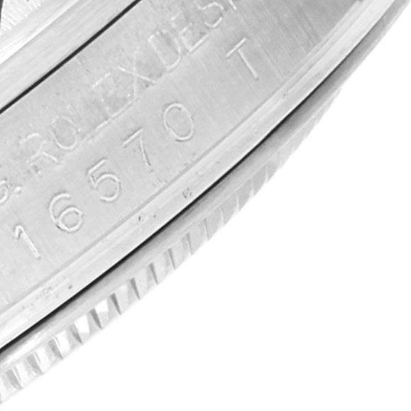 The image shows a close-up of the side casing and serial number of a Rolex Explorer 16570 Men's Stainless Steel White Dial 16570 Men's Stainless Steel White Dial watch.