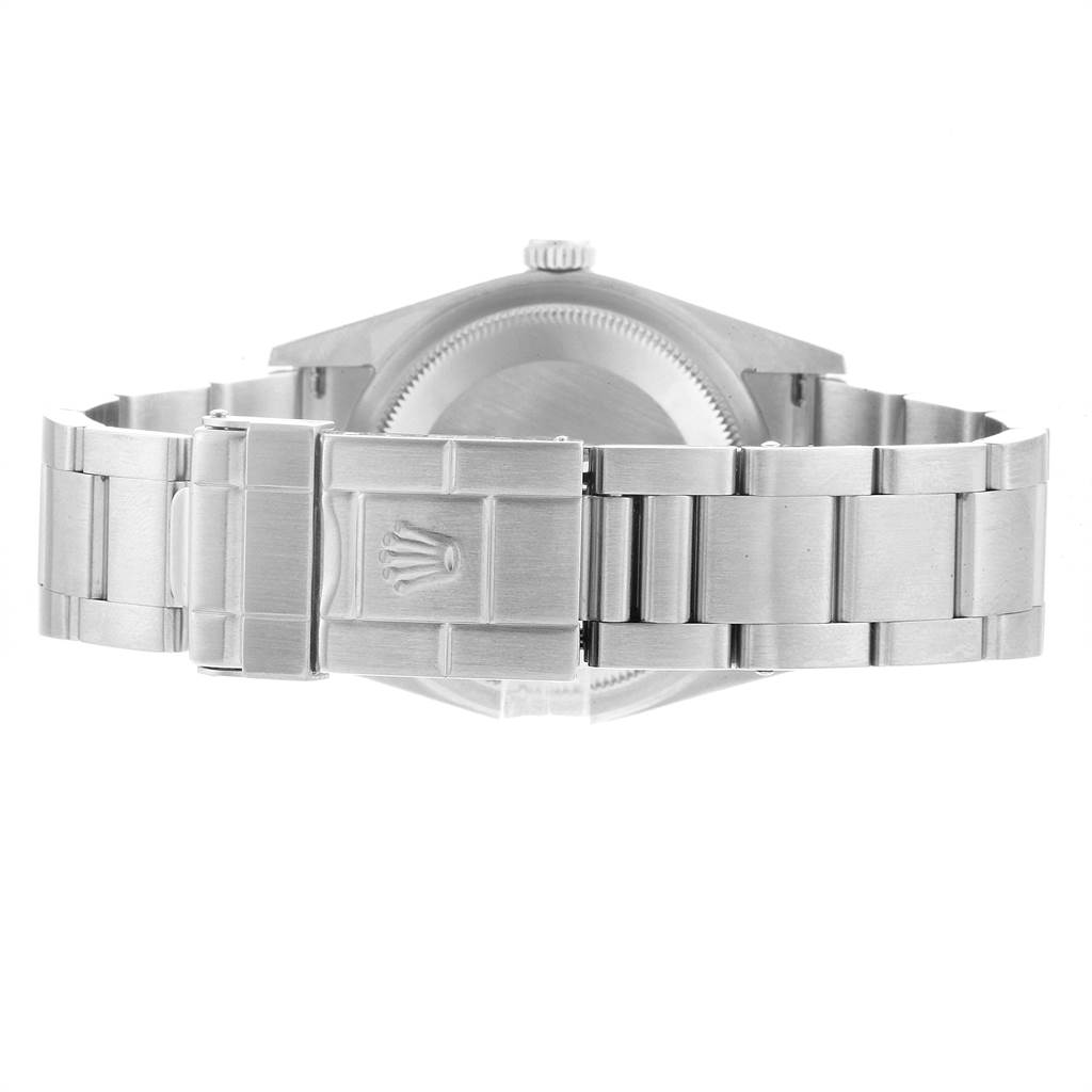 This image shows the back case and bracelet clasp of the Rolex Explorer 114270 Men's Stainless Steel Black Dial 114270 Men's Stainless Steel Black Dial watch with the Rolex logo on the clasp.