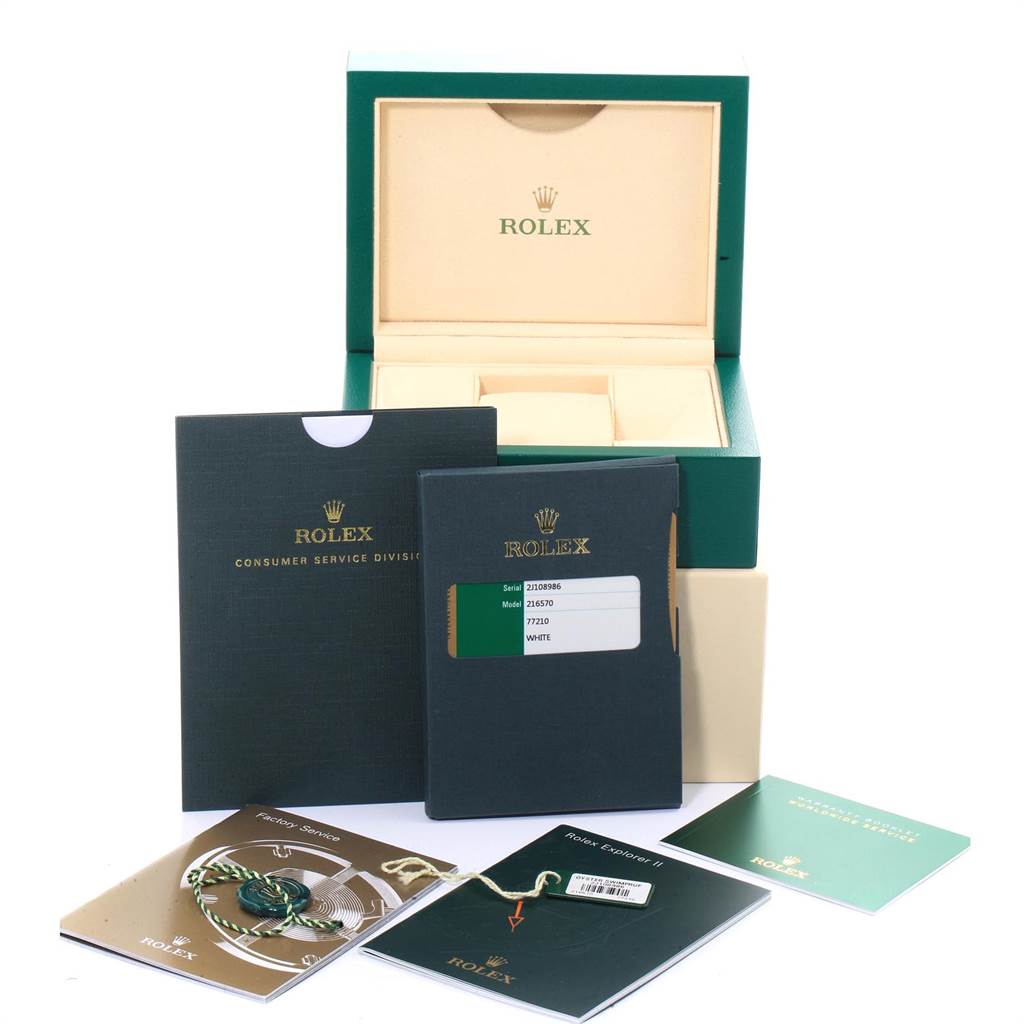 The image shows the packaging, documents, and accessories of a Rolex Explorer 216570 Men's Stainless Steel White Dial 216570 Men's Stainless Steel White Dial watch, including the box and paperwork.