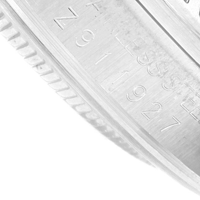 This close-up image shows the engraved serial number on the inner bezel of the Rolex Explorer 16570 Men's Stainless Steel White Dial 16570 Men's Stainless Steel White Dial watch.
