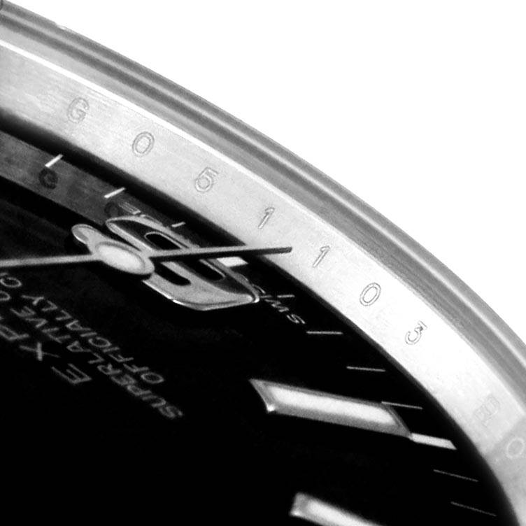 The image shows a close-up of the dial and bezel of a Rolex Explorer 214270 Men's Stainless Steel Black Dial 214270 Men's Stainless Steel Black Dial watch, emphasizing the minute markers and hands.