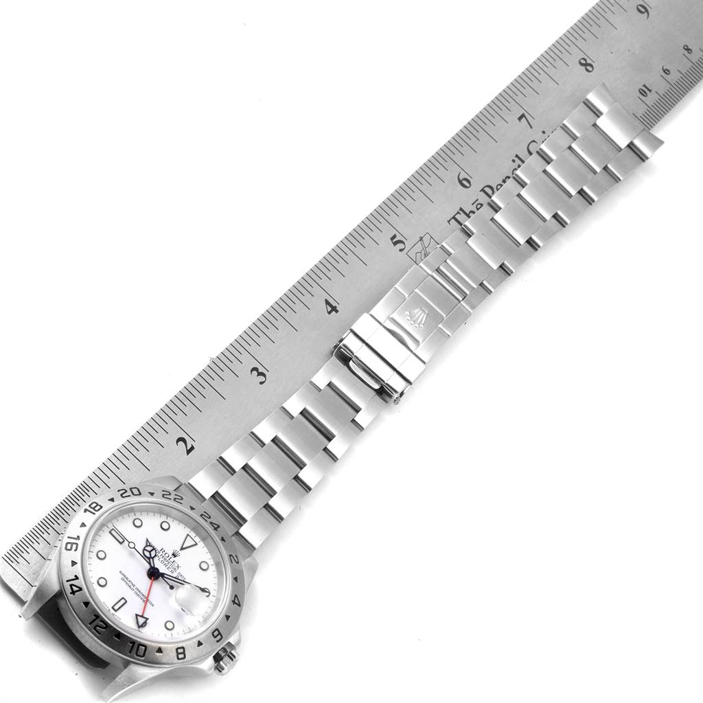 The image displays a Rolex Explorer 16570 Men's Stainless Steel White Dial 16570 Men's Stainless Steel White Dial watch face and band, positioned next to a ruler for measurement.