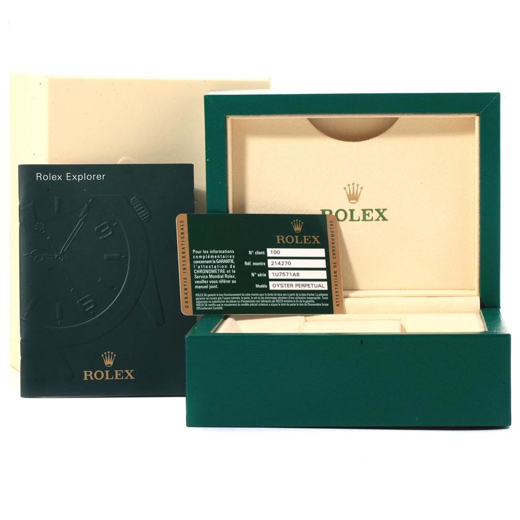 The image shows the box, booklet, and warranty card of the Rolex Explorer 214270 Men's Stainless Steel Black Dial 214270 Men's Stainless Steel Black Dial model.