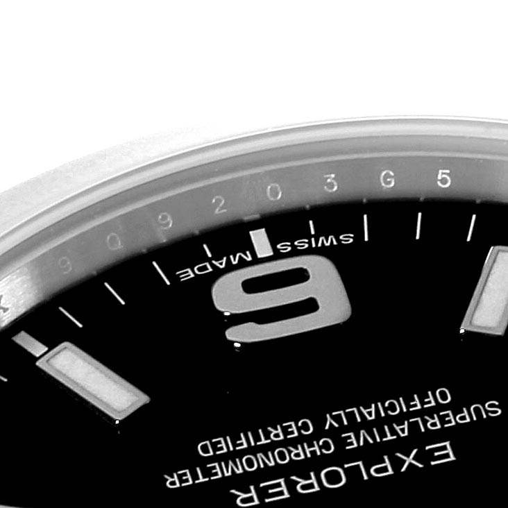 The image shows a close-up of the dial of a Rolex Explorer 214270 Men's Stainless Steel Black Dial 214270 Men's Stainless Steel Black Dial, angled to highlight the "9" hour marker and "Swiss Made" text.