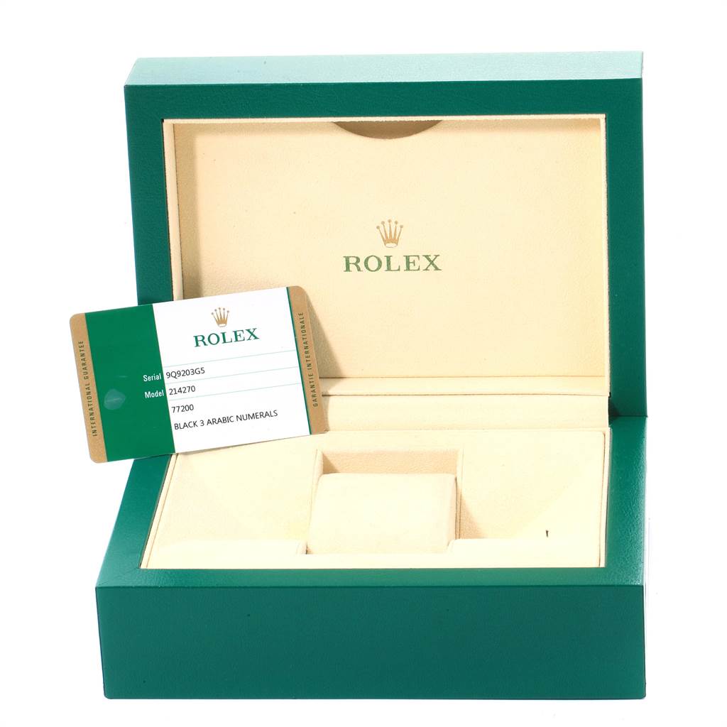 The image shows an open Rolex Explorer 214270 Men's Stainless Steel Black Dial 214270 Men's Stainless Steel Black Dial watch box with its warranty card placed inside.