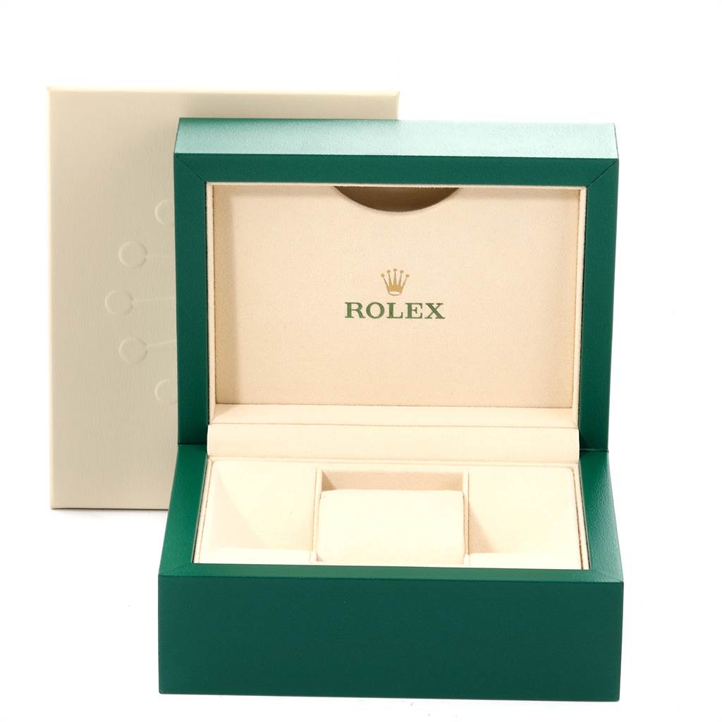 The image shows the open green and cream-colored box for the Rolex Explorer 216570 Men's Stainless Steel Black Dial 216570 Men's Stainless Steel Black Dial model, displaying its interior compartments.