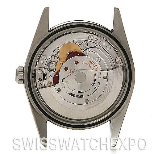 The image shows the back view of a Rolex Explorer 114270 Men
s Stainless Steel Black Dial 114270 Men
s Stainless Steel Black Dial watch case, revealing its internal mechanical movement.