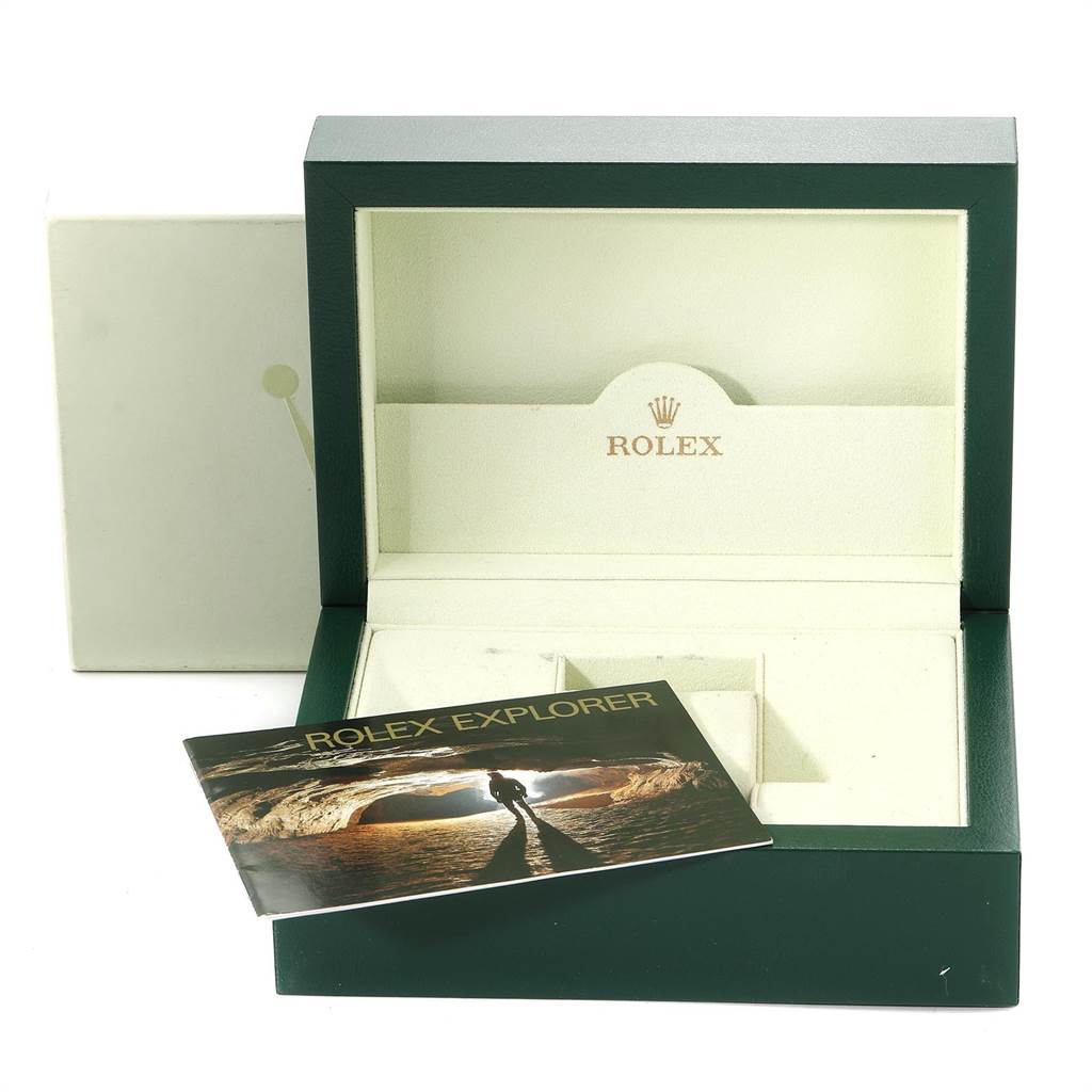 The image shows an open Rolex Explorer 114270 Men's Stainless Steel Black Dial 114270 Men's Stainless Steel Black Dial watch box and an accompanying booklet from a front angle.